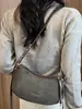 Bolso liso muy elegante 2026 nuevo bolso de axila francés de nicho para el día a día bolso de hombro cruzado casual a la moda para mujer