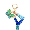 Llavero de Resina con Lentejuelas Azul Cian Letra Llavero con Borla de Mariposa Colgante Pequeño para Mujeres Pareja Venta Caliente Transfronteriza