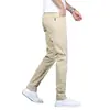 Pantalones casuales para hombre, nuevos pantalones tipo cigarrillo ajustados de negocios color caqui para primavera y otoño, pantalones largos elásticos para hombre, versátiles de largo nueve puntos