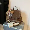 Mochila de Lana para Mujer con Empalme de Color Contrastante Otoño e Invierno 2025 Nueva Mochila Versátil Exquisita Mini Mochila Escolar