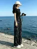 Conjunto Duas Peças: Blusa Preta de Manga Curta com Gola Redonda e Calça Wide Leg - Traje Esportivo Casual Emagrecedor para Mulheres - Verão 2026