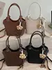 Bolsa de cubo de mano Shuai Mi Jia estilo coreano ins de moda para mujer, nuevo modelo de principios de otoño 2026, bolso de hombro simple y elegante, bolso de cubo