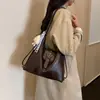 Mochila de nicho para mujer, bolso de hombro único de moda para principios de otoño, moderno y versátil, gran capacidad, estilo coreano, bolsa de mano simple, modelo nuevo
