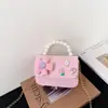 Nueva Versión Coreana Transfronteriza Bolso Infantil de Lazo Pequeño Estilo Chanel Camelia Bolso de Hombro Bolso de Mano con Perlas Versátil Bolso Cruzado