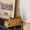 Bolso de axila para mujer 2026 nuevo de verano moderno nicho súper popular exquisito para ir al trabajo hombro bandolera cubo