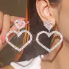 Moda Todos de Cobre Versátiles Pendientes Largos con Borla y Lazo Pendientes de Botón Brillantes con Pedrería Joyería al por Mayor