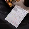 Pegatinas de mariposa para redes sociales, pegatinas para decoración de uñas, surtido de 50, adhesivas, calcomanías de uñas 5D en relieve, venta al por mayor, luz de concha, luminosas