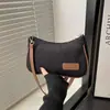 2025 Bolsa de Ombro Portátil Leve Cor Sólida Casual Versátil Bolsa de Axila Ondulada Simples para o Dia a Dia Bolsa de Mão Bolsa Feminina