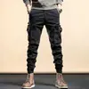 Calças masculinas de marca da moda para primavera e outono, calças justas com pernas largas, calças pretas de motocicleta americana com várias bolsas para inverno
