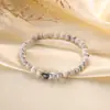 Pulsera de piedra ojo de tigre de color simple de moda, pulsera tejida a mano con cuentas de alto sentido de nicho, joyería para damas al por mayor