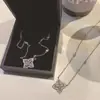 Versa chico guapo Tan clave tiempos mismo collar hombres y mujeres pareja chapado en oro microincrustado circón brillante colgante exquisito diario