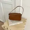 Bolso Redondo Cilíndrico Nuevo Pequeño de Nicho Casual Retro Gamuza Mate para Mujer Simple Versátil para el Viaje Diario de Mano