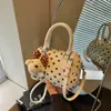 Bolso Boston de color de bloque de lunares de nicho transfronterizo para mujer, nuevo bolso de hombro y cruzado informal con textura para el verano de 2026