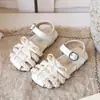 Sandalias Romanas ins retro con torsión 2026 verano nuevo versión coreana para niñas punta cerrada tejido lazo zapatos de princesa