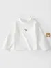 Nueva Camiseta de Primavera y Otoño, estilo coreano, cuello semi-alto, manga larga, cara sonriente, color liso, simple, top básico para bebé e infante