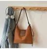 Bolsa Tote para Trajeto Transfronteiriço para Mulheres 2026 Nova Mochila de Grande Capacidade Versátil Casual Nicho Bolsa de Ombro Bolsa Transversal
