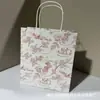 Caja plegable para loción corporal Oushu Bolsa de regalo Empaque Caja vacía Bolsa de regalo Crema de manos Gel de ducha Caja de empaque Kraft Papel