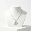Collar con colgante de pata de gato de acero inoxidable europeo y americano, joyería al por mayor con colgante de huella de pata de perro simple personalizado