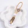 Cordão para Celular Nó de Diamante Curto Rosto Sorridente Combinação de Cores Cordão Trançado Enrolado Chaveiro de Pelúcia Acessórios de Alça Anti-Perda