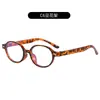 Nuevas Gafas de Marco Ovalado Retro para Mujer Personalidad Artística Lentes Planos Simples Decoración de Remaches Clásica Montura de Espejo Lisa