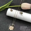 Conjunto de pendientes y collar Xuping estilo vintage de nicho europeo y americano transfronterizo, conjunto de joyería elegante de aleación de cobre, venta al por mayor y hecho a medida