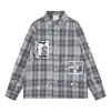 SAVAGEBASE Camisa xadrez de algodão com estampa de desenho animado retrô japonesa desgastada outono 2026 nova com respingos de tinta
