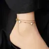 Tobillera en forma de corazón con cuentas blancas, cadena de doble capa chapada en oro, una tobillera elegante y versátil con un toque lujoso, un artículo muy vendido en Temu