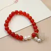 Pulsera original de ágata roja de moda nacional Colgante de calabaza de jade dorado y orquídea de perla Joyería al por mayor
