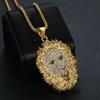 Collar con colgante de cabeza de león de ojos verdes y diamantes de imitación chapados en oro de acero inoxidable con diseño de animales de hip-hop transfronterizos de Europa y América.