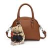 Bolso de mano de alta gama para mujer, primavera y verano 2025, nuevo, sencillo, para ir al trabajo, bandolera de hombro, bolso informal coreano con forma de concha