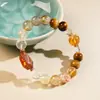 Pulsera de Cristal Súper Siete Tesoros Múltiples Negro Dorado Natural con Cuentas para Niñas Lujo Ligero Alta Gama Pulsera de Cristal Torre Amarilla Estilo Popular Venta al por Mayor