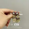 Nuevos Pendientes de Carrillón de Viento de Zirconia Colorida Microincrustada 2025 para Mujer con Pétalos Tridimensionales, Pendientes Adelgazantes para Rostro Redondo y Pendientes