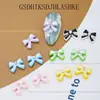 Celebridad en línea joyería para uñas lazo de cinta aleación pintura en aerosol rhinestone japonés lazo decoraciones para uñas al por mayor
