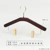 Percha para pantalones de madera maciza en color nogal negro, especialmente para tiendas de ropa, para uso doméstico y de hotel, sin marcas, antideslizante, percha con pinza de madera para pantalones al por mayor