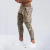 Otoño e invierno Europa y Estados Unidos transfronterizo nuevos pantalones fitness ocio running deportes entrenamiento hombres pie pequeño pantalones ajustados