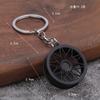 Accesorios de modificación de automóviles transfronterizos directos de fábrica, pequeños regalos, colgante de rueda de metal para hombres, llavero de rueda al por mayor