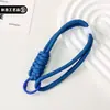 Llavero simple de paracord bicolor con hebilla roscada, tejido en poliéster de color dopamina, accesorio de llavero hecho a mano de doble capa