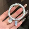 Nuevo estilo ins fresco y lindo conejo de dibujos animados de fresa cordón para teléfono alta elasticidad dulce y adorable scrunchie para mejores amigos