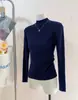 Camiseta Base de Punto con Cuello Alto y Hilo de Mecha para Mujer Otoño e Invierno 2026 Suéter con Cuello Alto y Hombro Normal