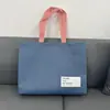 Bolsa de Tela No Tejida Gruesa de Moda Tridimensional para Tienda de Ropa de Mujer y Niño Bolsa de Mano Bolsa de Compras Logo Personalizado