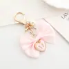 Nuevo Colgante de Lazo de Perlas Creativo y Personalizado Bolso Colgante Funda para Teléfono Móvil Colgante de Llavero Exquisitos Accesorios de Regalo Pequeños