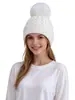 Gorro de punto grueso para adultos de venta caliente transfronterizo, color liso con pompón, cálido y a prueba de viento, gorro de punto para cubrir las orejas al aire libre