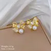 [Acero de titanio] Conjunto de collar y pendientes con diseño de lazo de perla y diamantes de imitación, elegante y ligero, para banquetes.