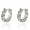 Accesorios europeos y americanos aretes de hebilla de oreja de doble fila de diamantes con diamantes completos venta caliente transfronteriza moda lujo ligero circonita completa micro incrustada hebilla de oreja femenina