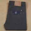Otoño e Invierno nuevo algodón cinco bolsillos pantalones de hombre rectos ajustados elásticos gruesos moda caqui pantalones casuales de hombre