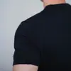 Camiseta informal de manga corta para hombre de verano con cuello redondo, puños, corte ajustado, sin botones, color liso, manga media