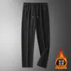 Pantalones casuales gruesos con forro polar para hombre, pantalones deportivos de otoño e invierno, corte holgado, versátiles, pantalones rectos con puño, pantalones largos para hombre