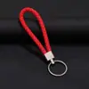 Llavero colgante de cuerda de cuero tejido de fábrica con cabeza de plástico para pareja, llavero de coche de cuero, colgante, accesorios, venta al por mayor