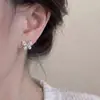 Pendientes de botón de mariposa con pasador de plata de ley 999 para mujer, pendientes únicos y hermosos, nuevo estilo popular 2026, joyería para orejas de alta gama, muy bonitos