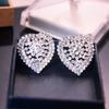 Pendientes de plata con forma de aguja y diamantes, con diseño de nicho exagerado, estilo europeo y americano, para mujer, con diamantes superdeslumbrantes, corazón de melocotón y perla.